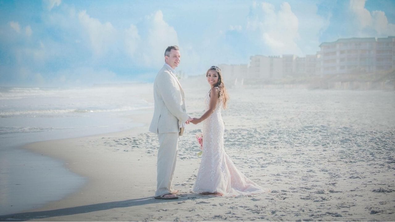 Bride and groom on beach