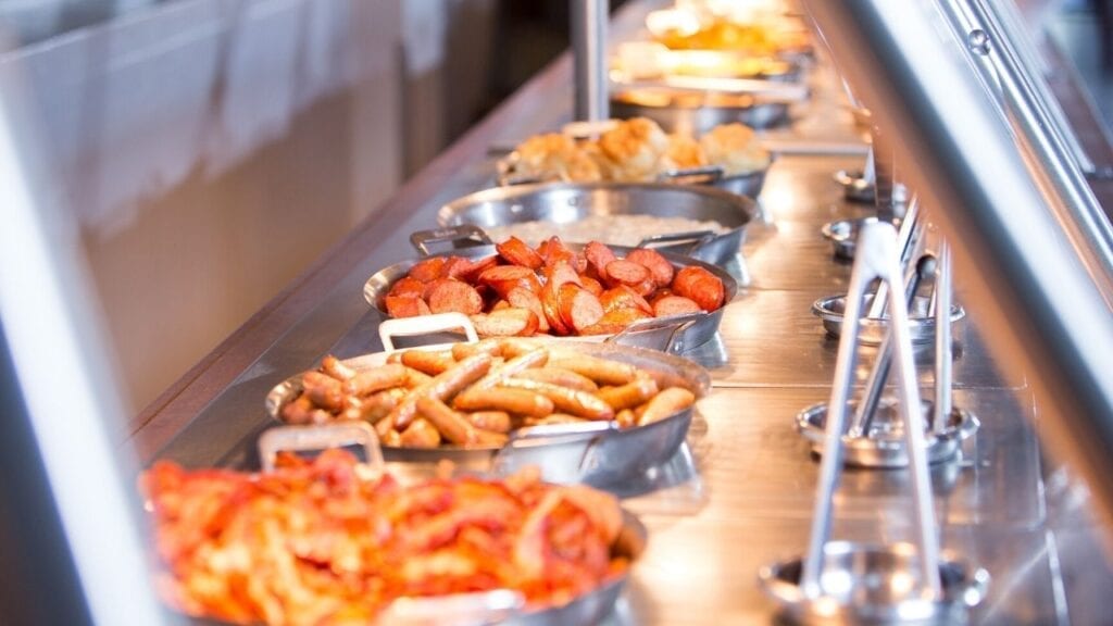 Breakfast buffet with bacon ., sausage, and eggs