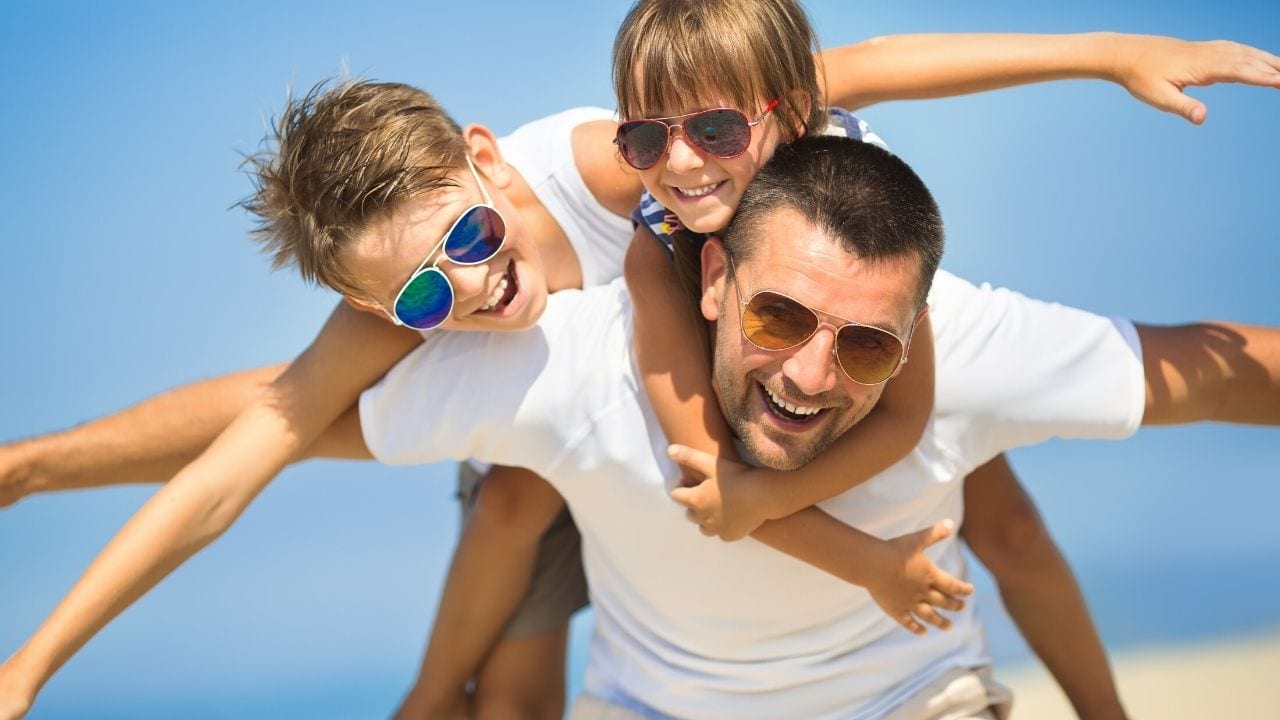 Father and Sons on the Beach