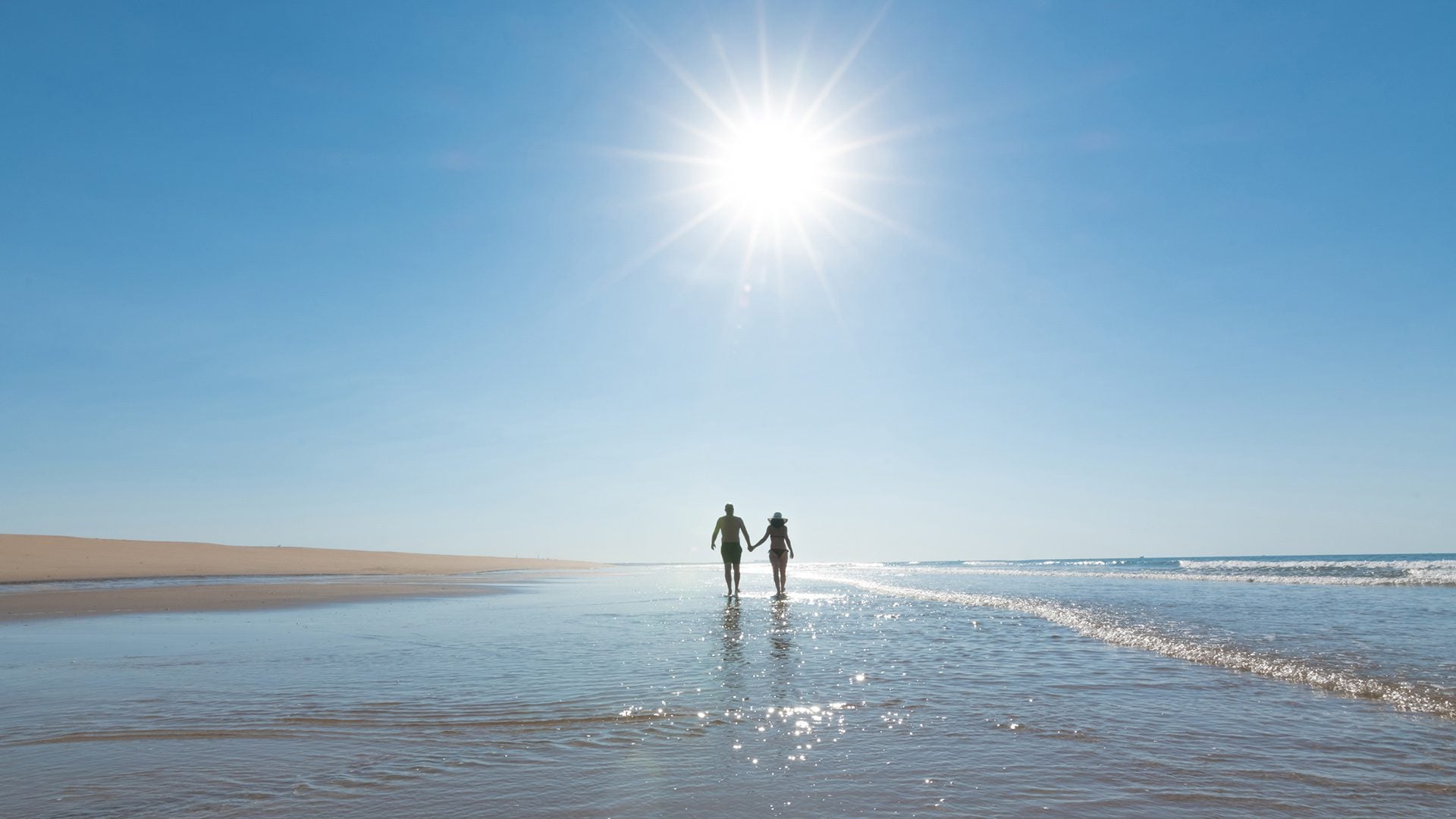 Couple walking on the beach