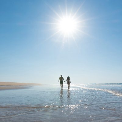 Couple walking on the beach